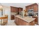 Modern kitchen with custom cabinets, granite countertops, and stainless steel appliances at 705 Normandy Rd, Mooresville, NC 28117