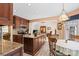 Kitchen island with granite countertops, stainless appliances, and adjacent breakfast area with bright natural light at 705 Normandy Rd, Mooresville, NC 28117