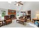 Inviting living room with a brick fireplace, open to the kitchen, creating a warm and welcoming space at 705 Normandy Rd, Mooresville, NC 28117