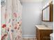 Bathroom features a vanity with wood cabinet, shower curtain and medicine cabinet at 71 14Th Se St, Hickory, NC 28602
