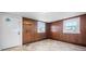 Entryway featuring wood paneling, two windows, and a white front door at 71 14Th Se St, Hickory, NC 28602