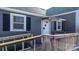 Ramped access to front door with gray siding at 71 14Th Se St, Hickory, NC 28602
