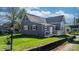 Charming gray home featuring a welcoming front porch and well-maintained lawn at 71 14Th Se St, Hickory, NC 28602