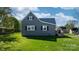 Side view of gray house with well-kept lawn and symmetrical window placement at 71 14Th Se St, Hickory, NC 28602