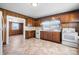 Traditional kitchen features wood cabinets, retro appliances, and views to the living area at 71 14Th Se St, Hickory, NC 28602