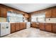 The kitchen features vintage cabinetry, a stove, sink, and ample natural light at 71 14Th Se St, Hickory, NC 28602