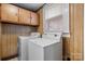 Laundry room features upper wood cabinets, and includes washer and dryer at 71 14Th Se St, Hickory, NC 28602