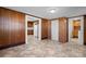 Living room offers an open floor plan with view to kitchen, with wood paneled walls at 71 14Th Se St, Hickory, NC 28602