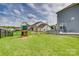 Large backyard with a swing set and a patio area at 7157 Sumters Camp Trl, Indian Land, SC 29707