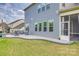 Backyard with a stone patio, an outdoor seating area and a screened in porch at 7157 Sumters Camp Trl, Indian Land, SC 29707
