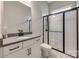 Modern bathroom featuring a sleek vanity with black fixtures and a frameless glass shower at 7157 Sumters Camp Trl, Indian Land, SC 29707