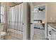 A bathroom with a shower curtain, toilet, and a view of the bedroom with gray walls at 7157 Sumters Camp Trl, Indian Land, SC 29707
