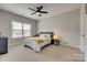 Bedroom features neutral paint, a ceiling fan and a window for lots of natural light at 7157 Sumters Camp Trl, Indian Land, SC 29707