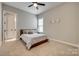 Clean bedroom with neutral walls, a ceiling fan, a double bed, and a bedside table at 7157 Sumters Camp Trl, Indian Land, SC 29707