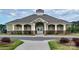 Community clubhouse featuring green siding, stone accents, and white columns at the entrance at 7157 Sumters Camp Trl, Indian Land, SC 29707