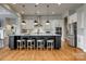 Spacious kitchen with a large center island, stainless steel appliances, and modern pendant lighting at 7157 Sumters Camp Trl, Indian Land, SC 29707