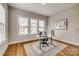 Well-lit home office with neutral walls, a modern desk, chair, and decorative accents at 7157 Sumters Camp Trl, Indian Land, SC 29707