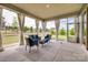 Screened in back porch featuring curtains, outdoor seating, and an outdoor view at 7157 Sumters Camp Trl, Indian Land, SC 29707