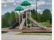 Community playground with slides, climbing structures, and a soft, padded ground for safe play at 7157 Sumters Camp Trl, Indian Land, SC 29707