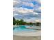 Community pool featuring a clear blue swimming area surrounded by a concrete deck with seating at 7157 Sumters Camp Trl, Indian Land, SC 29707