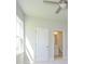 Bedroom with a door to the bathroom, a window, and ceiling fan at 7185 Chamberlain Dr, Harrisburg, NC 28075