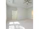 This bedroom has a trey ceiling with fan, carpet floors and an ensuite bathroom at 7185 Chamberlain Dr, Harrisburg, NC 28075