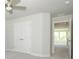Bedroom featuring double door closet and open doorway, with neutral walls and carpets at 7185 Chamberlain Dr, Harrisburg, NC 28075