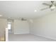 The extra bonus room features three ceiling fans, carpet floors, and a large open space at 7185 Chamberlain Dr, Harrisburg, NC 28075
