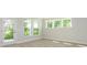 Dining room with a glass door, large windows, and natural light at 7185 Chamberlain Dr, Harrisburg, NC 28075