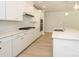 Bright kitchen with quartz countertops, stainless steel appliances and a center island with sink at 7185 Chamberlain Dr, Harrisburg, NC 28075