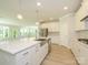 Modern kitchen featuring a large island, stainless steel appliances, and open concept design at 7185 Chamberlain Dr, Harrisburg, NC 28075