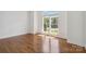 Bedroom with beautiful wood floors and a window view at 7302 Yellowhorn Trl, Waxhaw, NC 28173