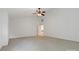 Spacious, light-filled bedroom features a ceiling fan and neutral carpet at 7302 Yellowhorn Trl, Waxhaw, NC 28173