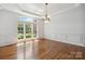 Dining room showcasing large windows and a decorative chandelier at 7302 Yellowhorn Trl, Waxhaw, NC 28173