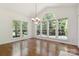 Bright dining room with a large window view and chandelier at 7302 Yellowhorn Trl, Waxhaw, NC 28173