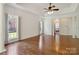 Spacious main bedroom with hardwood floors, natural light, and ensuite bathroom at 7302 Yellowhorn Trl, Waxhaw, NC 28173