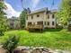 Spacious backyard with a wooden deck, ideal for outdoor entertaining and relaxing at 7409 Tarland Ln, Charlotte, NC 28269