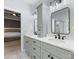 Dual sink vanity in this modern bathroom, offers lots of counter space and is updated at 7409 Tarland Ln, Charlotte, NC 28269