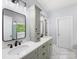 Bathroom featuring granite countertops, updated fixtures, and lots of light at 7409 Tarland Ln, Charlotte, NC 28269