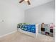 Comfortable bedroom featuring a twin bed, and room for storage at 7409 Tarland Ln, Charlotte, NC 28269