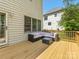 Relaxing outdoor deck with comfortable seating area and adjacent yard space at 7409 Tarland Ln, Charlotte, NC 28269