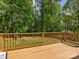 Deck view with outdoor seating and views of the lush, wooded backyard at 7409 Tarland Ln, Charlotte, NC 28269