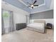 Spacious main bedroom featuring trey ceiling, and neutral tones at 7409 Tarland Ln, Charlotte, NC 28269