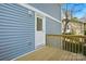 Exterior view of the back door to the home showing the siding and wood deck at 76 Snyder Ne Ct, Concord, NC 28025