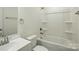 Bright bathroom featuring a vanity and a shower-tub combo, ideal for relaxation and functionality at 76 Snyder Ne Ct, Concord, NC 28025