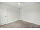 Neutral bedroom with carpet and white trim, providing a serene and adaptable space at 76 Snyder Ne Ct, Concord, NC 28025