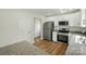 Modern kitchen with stainless steel appliances, granite countertops, and ample cabinet space at 76 Snyder Ne Ct, Concord, NC 28025