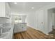 Open kitchen featuring granite countertops, stainless steel appliances and an eat-in island at 76 Snyder Ne Ct, Concord, NC 28025