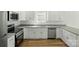 Modern kitchen featuring granite countertops, stainless steel appliances and ample cabinet space at 76 Snyder Ne Ct, Concord, NC 28025