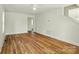 Spacious living room with new hardwood floors, fresh paint, lots of natural light and inviting atmosphere at 76 Snyder Ne Ct, Concord, NC 28025
